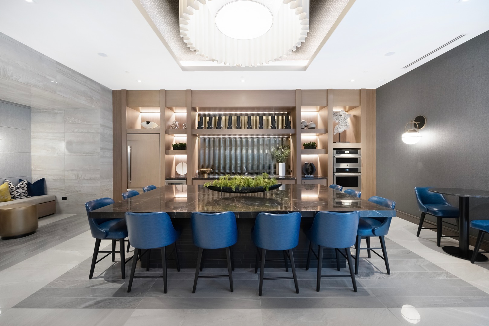 Elevate your gatherings in our stylish clubroom, featuring a fully equipped entertaining kitchen perfect for hosting and socializing.